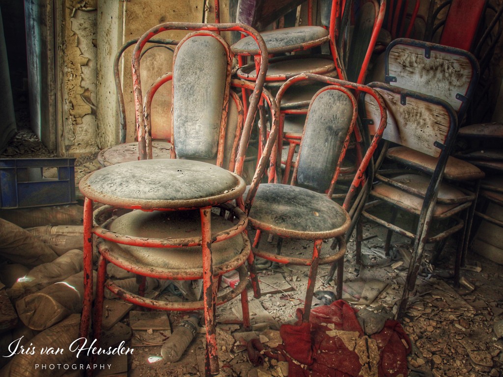 Chairs collecting dust in an abandoned Greek bakery-3