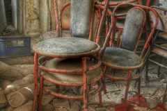 Chairs collecting dust in an abandoned Greek bakery-2